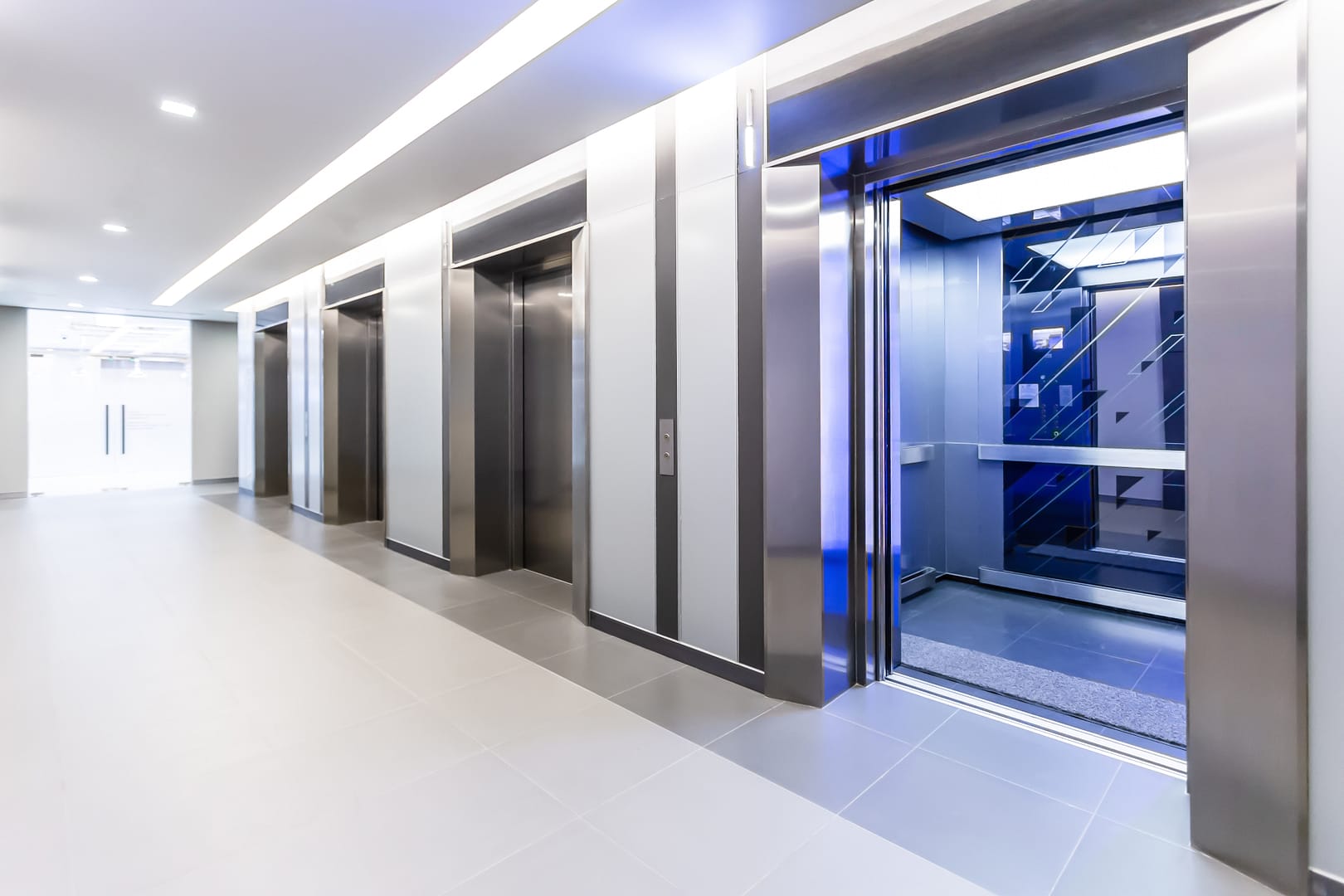 Modern,Steel,Elevator,Doors,Opened,Cabins,In,A,Business,Lobby Modern,Steel,Elevator,Doors,Opened,Cabins,In,A,Business,Lobby